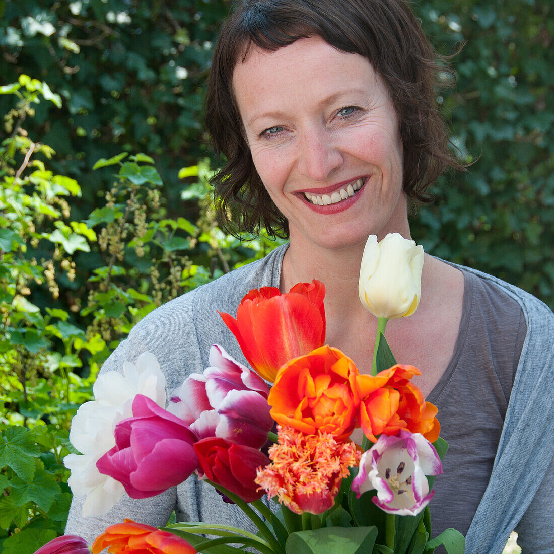 Woman holding spring flowers