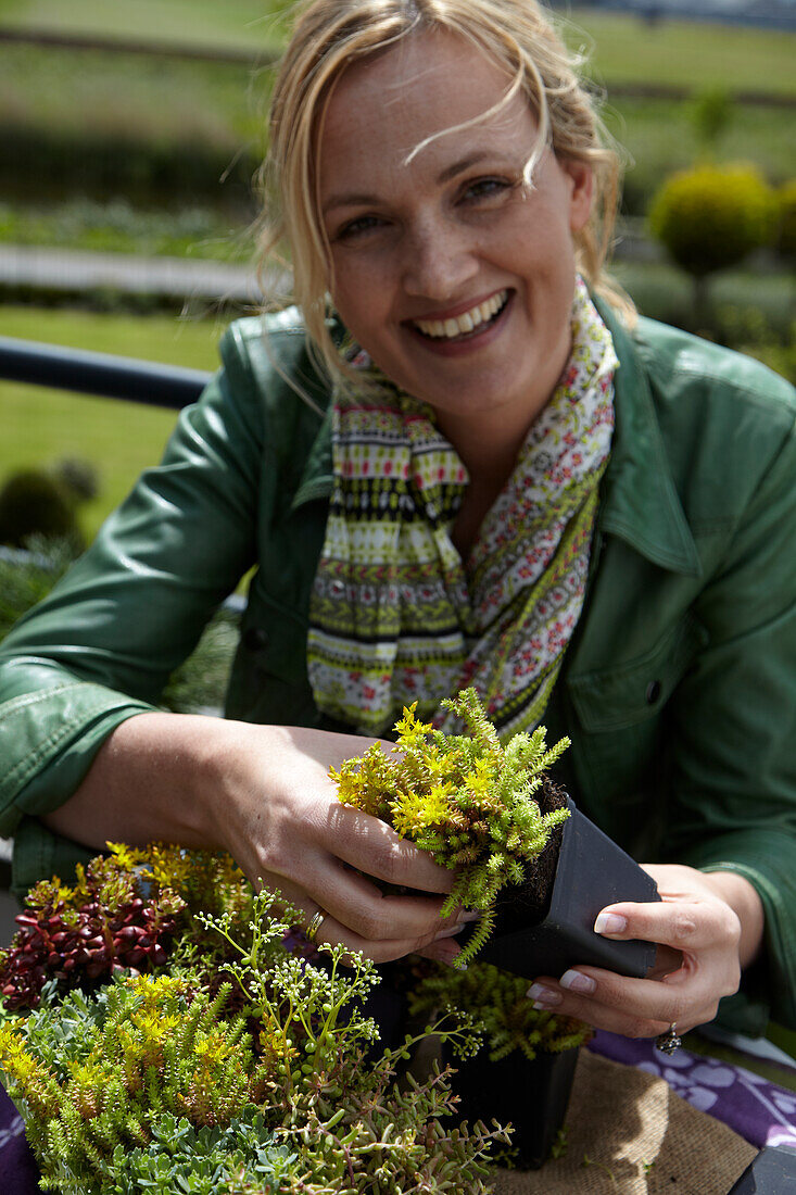 Woman planting succulents