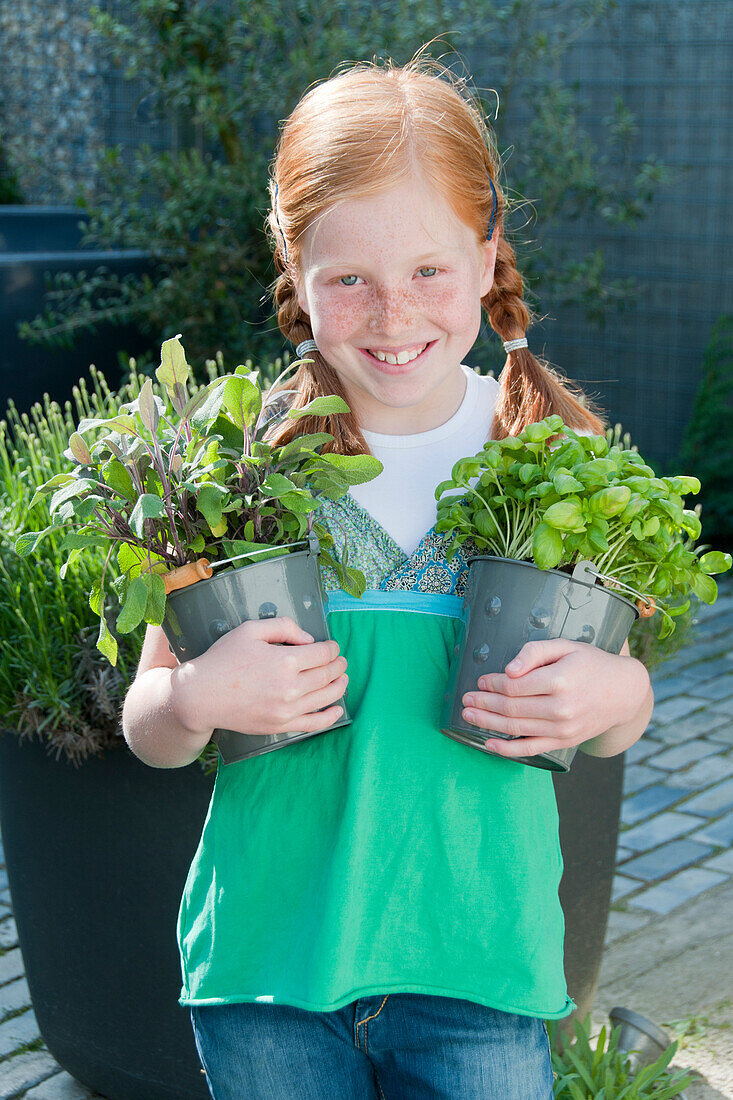 Girl holding herbs