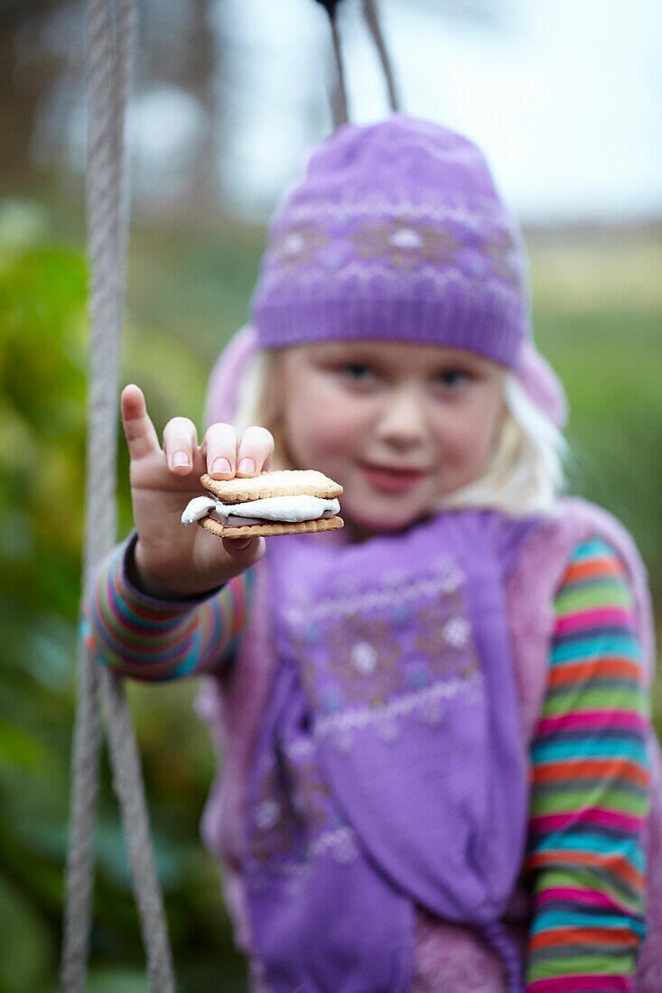 Girl eating s'mores