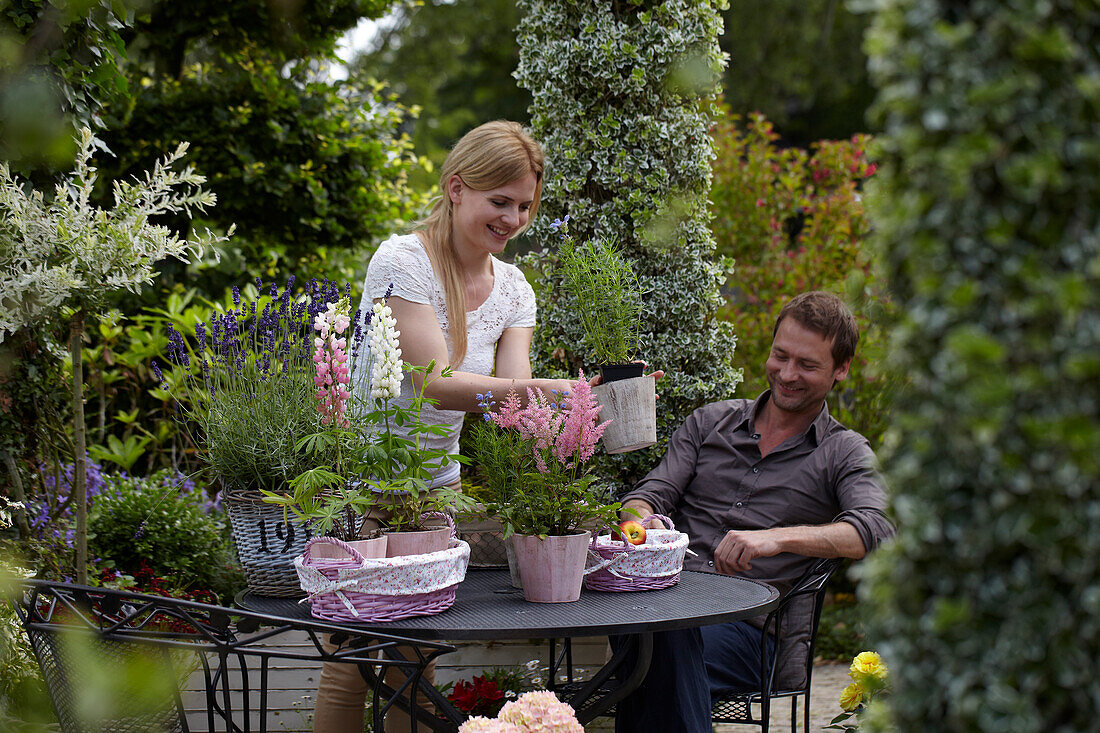 Woman decorating garden table