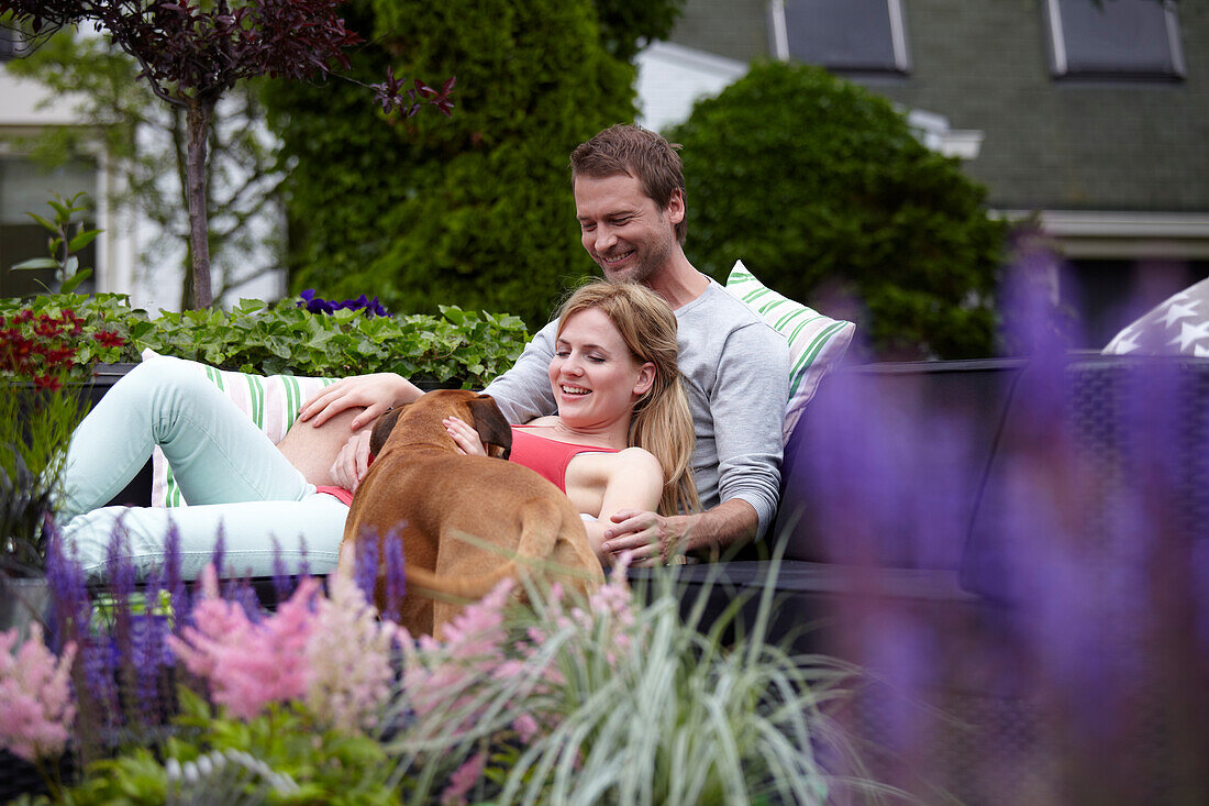 Couple relaxing in garden