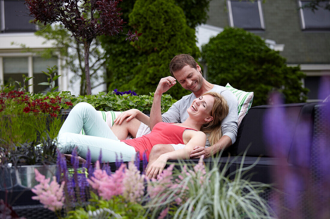 Couple relaxing in garden