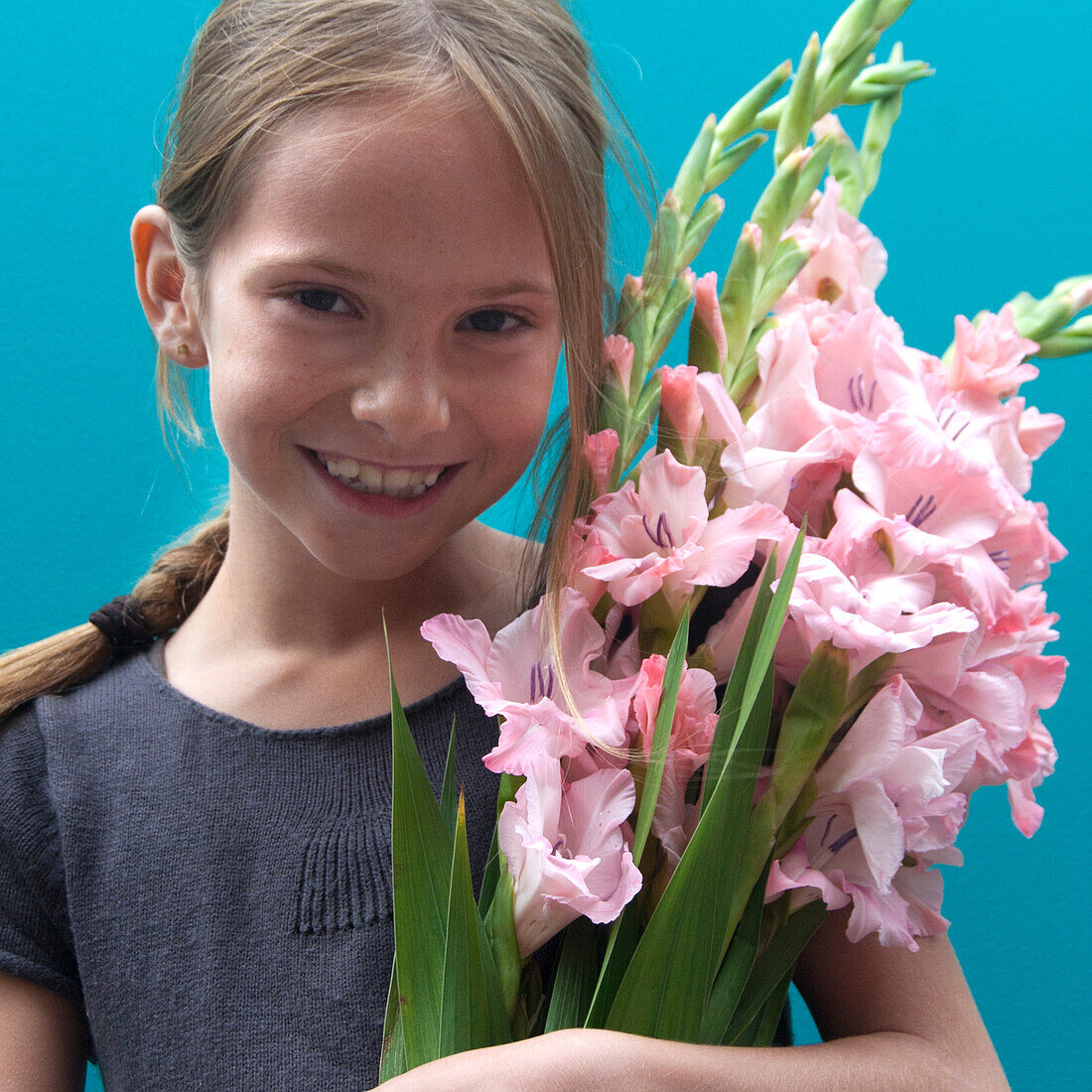 Girl holding Gladiolus
