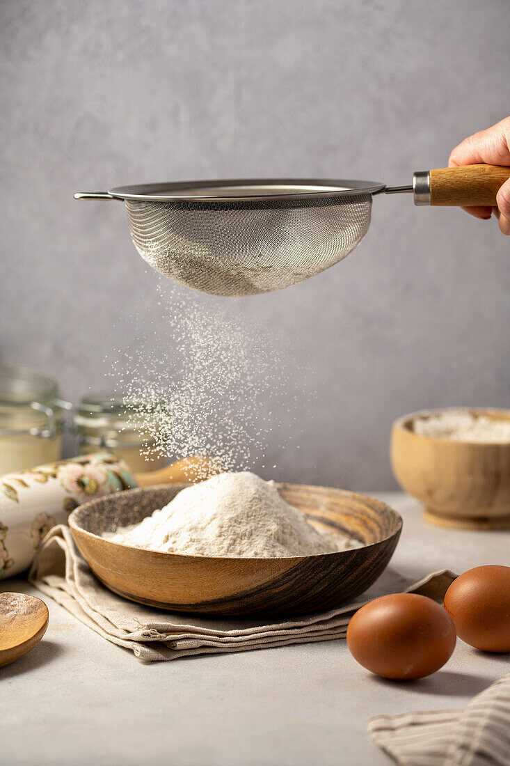 Sift white flour into a bowl