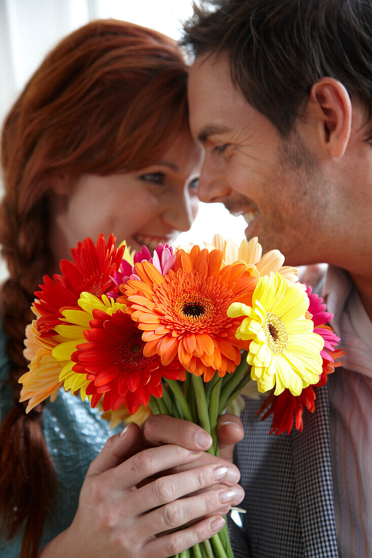 Couple holding flowers