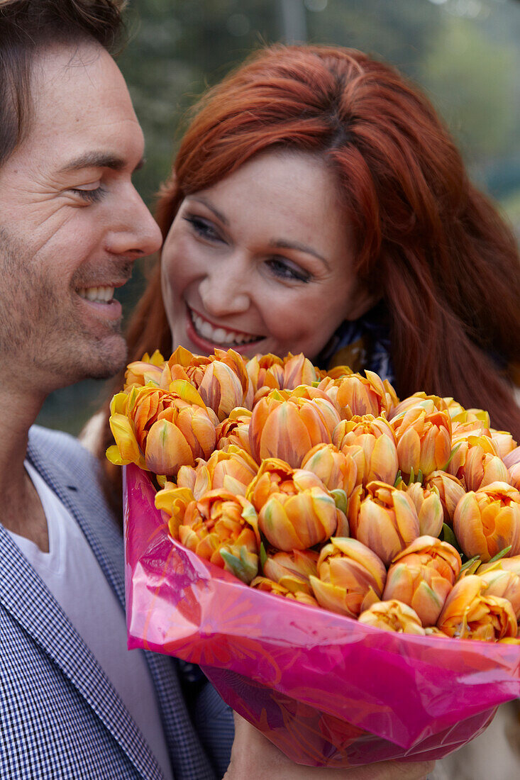 Couple holding flowers