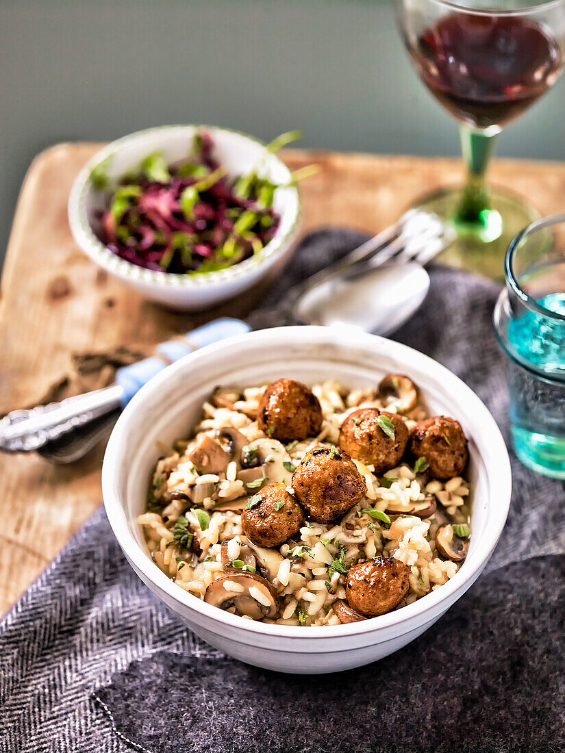Mushroom risotto with merguez balls and red cabbage salad