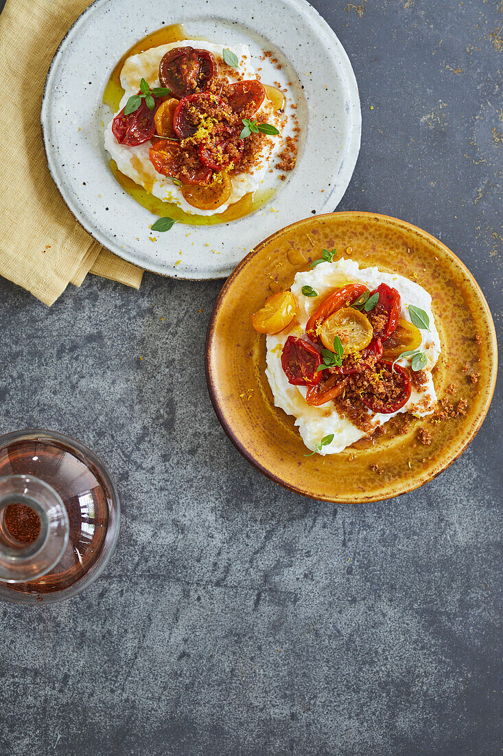Homemade ricotta with baked tomatoes, chestnut honey and pine nuts
