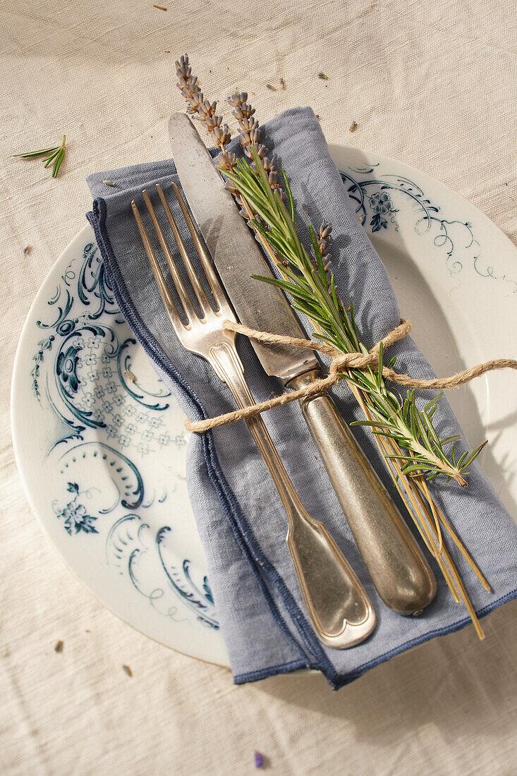 French table setting with rosemary and lavender