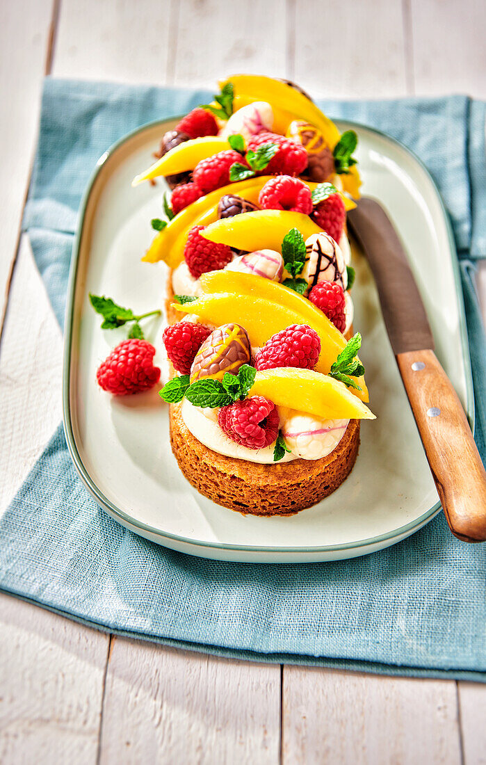 Easter cake with mascapone, raspberries and mango