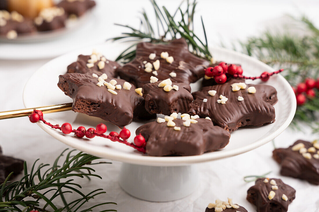 Vegan gingerbread with dark icing and almonds