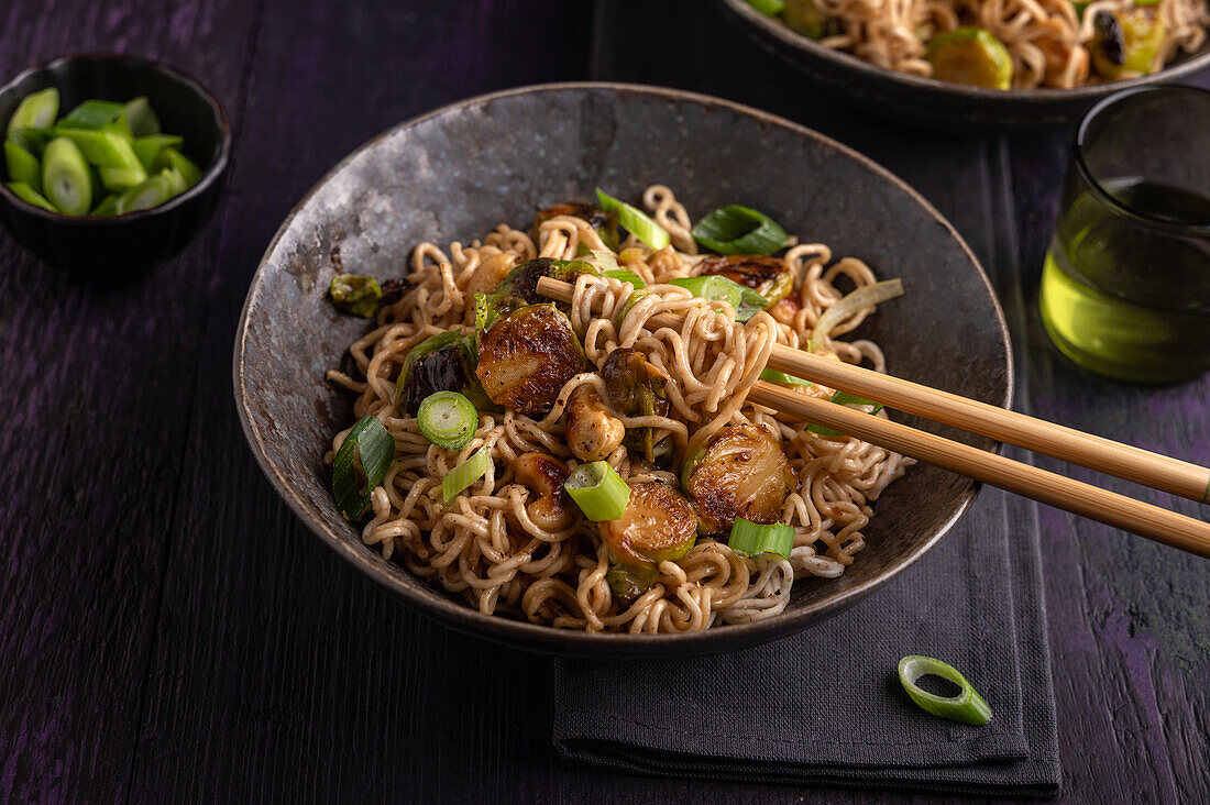 Asian noodle and Brussels sprout pan with cashews and spring onions