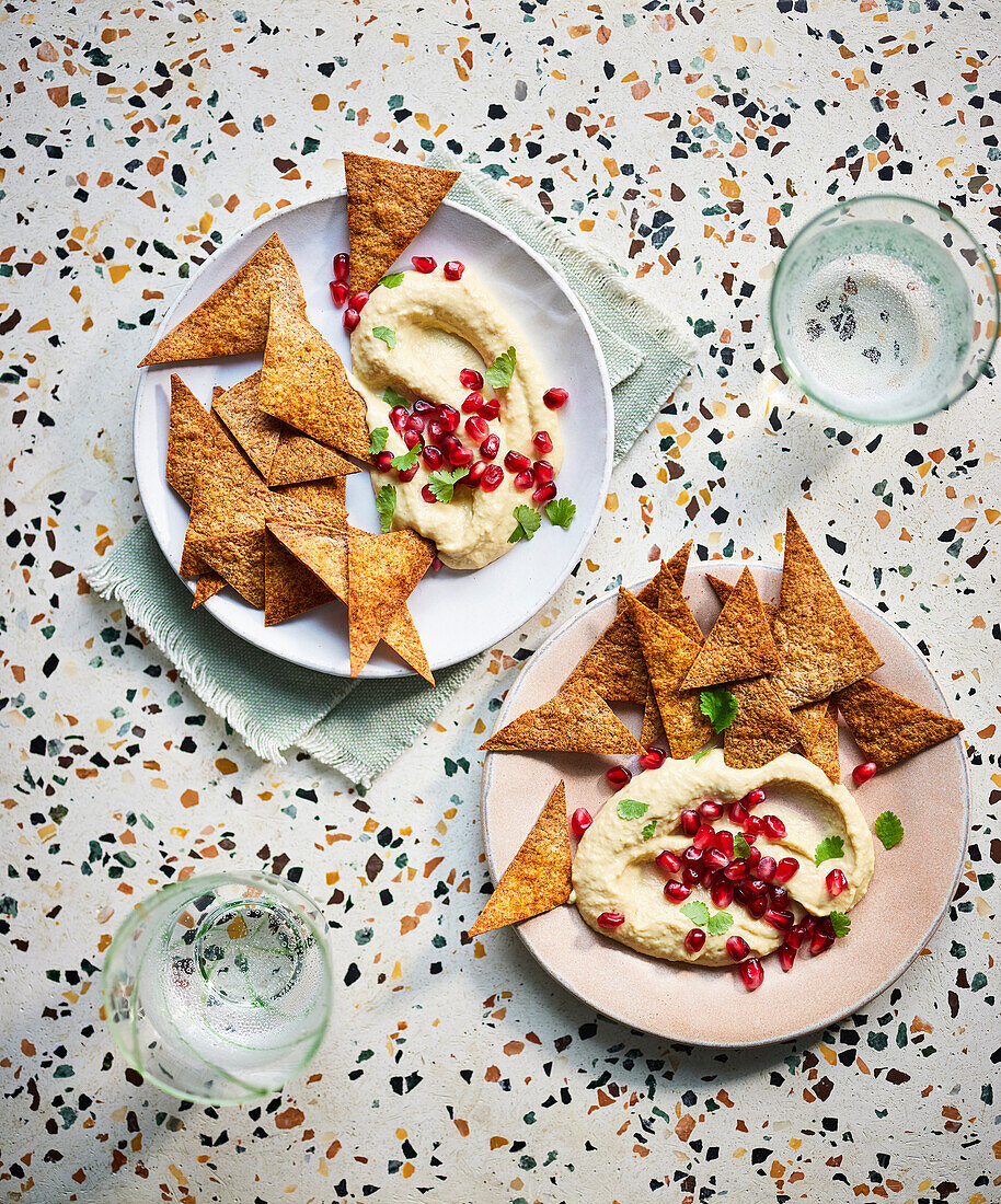 Spicy tortilla chips with pomegranate hummus