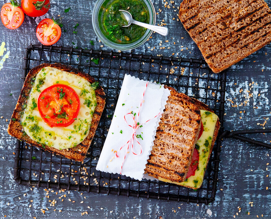 Wholemeal bread sandwich with tomatoes, pesto and cheese