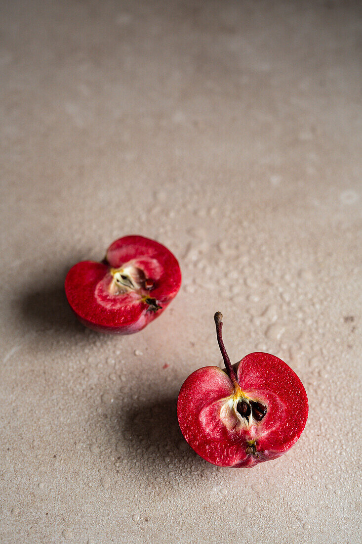 Red-fleshed apple, halved