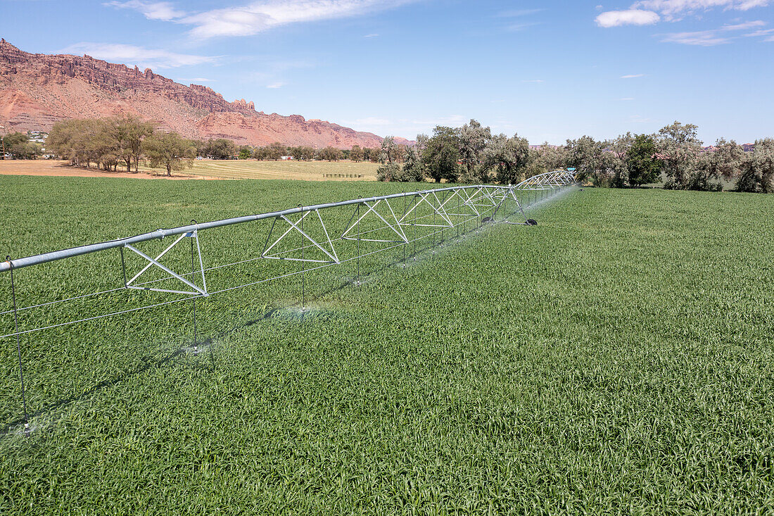 Center-pivot irrigation system watering field