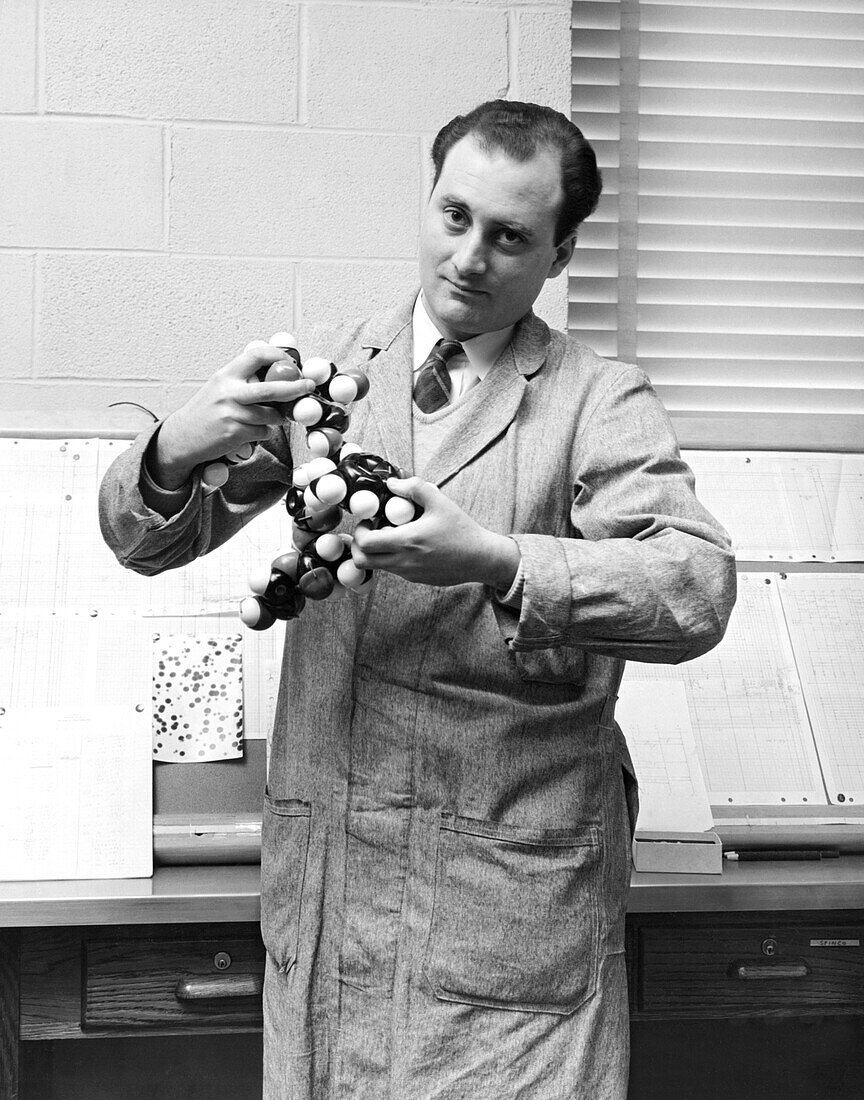 Scientist with molecule model