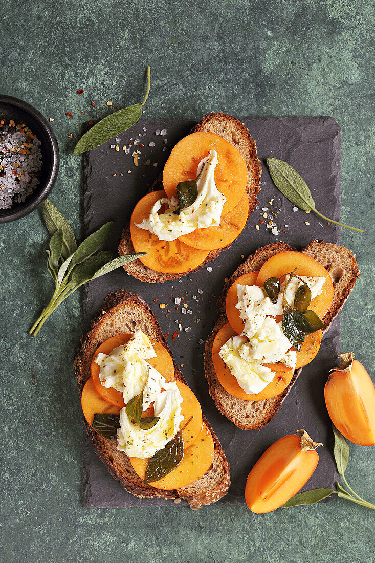 Persimmon crostini with mozzarella and sage oil