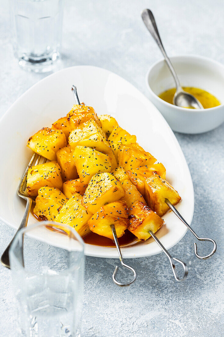 Grilled pineapple skewers with caramel sauce