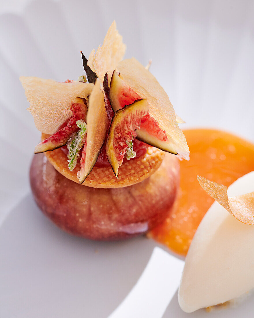 Artistic fig dessert with lemongrass sorbet