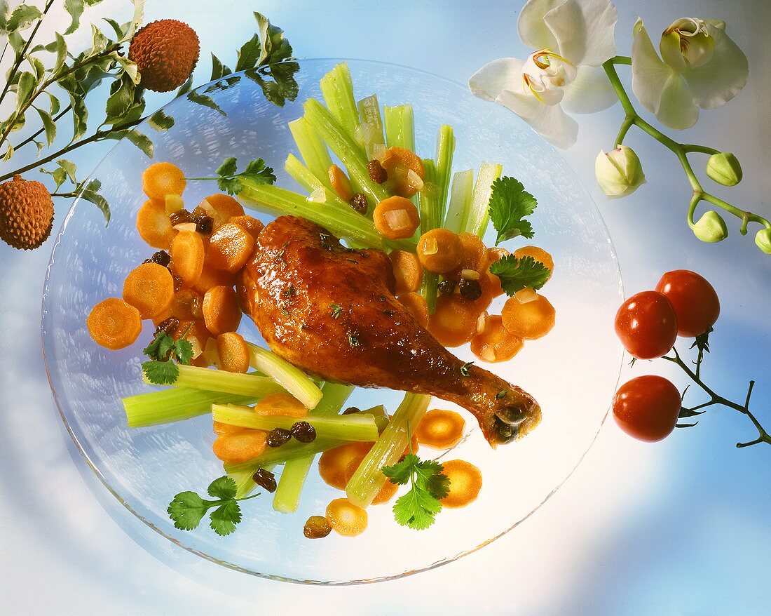 Chicken leg with carrots and celery and raisins