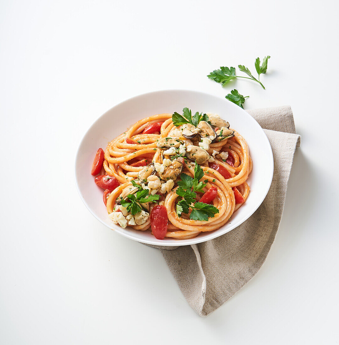Spaghettini with fish ragout and tomatoes