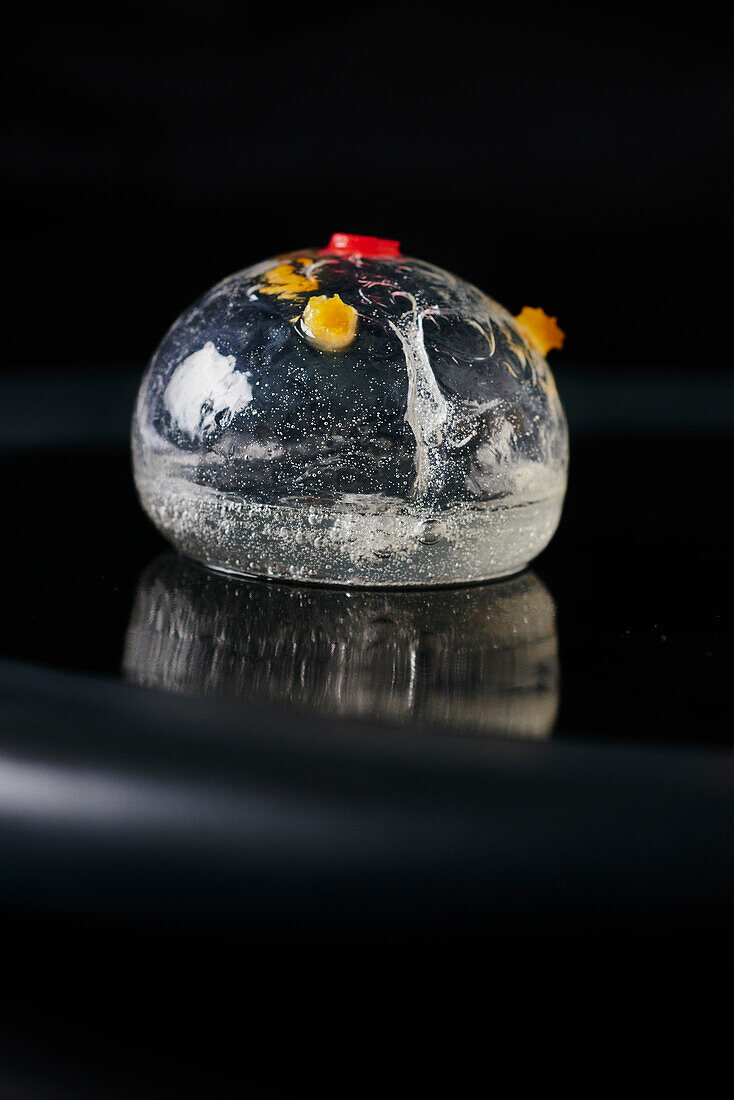 Ginger sphere with orange and Campari (molecular cuisine)