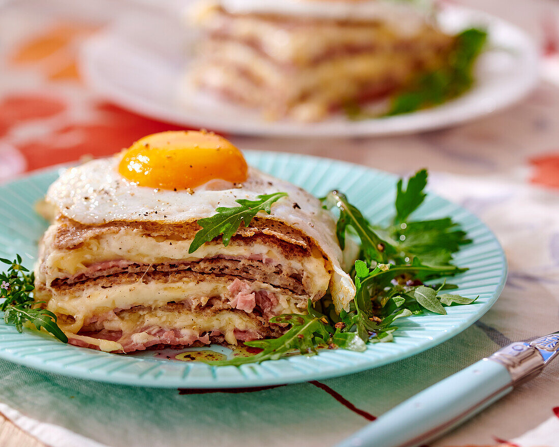 Buckwheat crêpe lasagne with cheese and fried egg