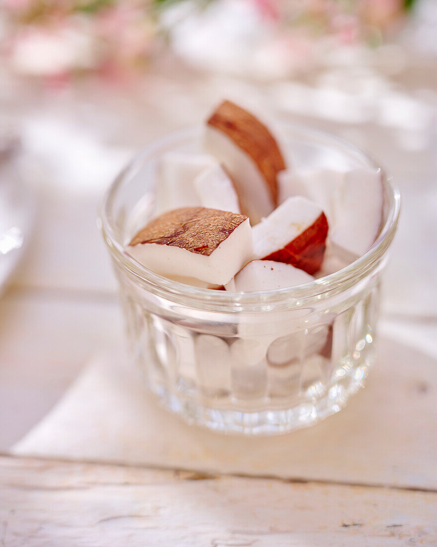 Coconut pieces in glass bowls