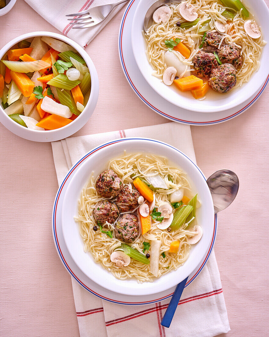 Pot au feu with beef meatballs, vegetables and noodles