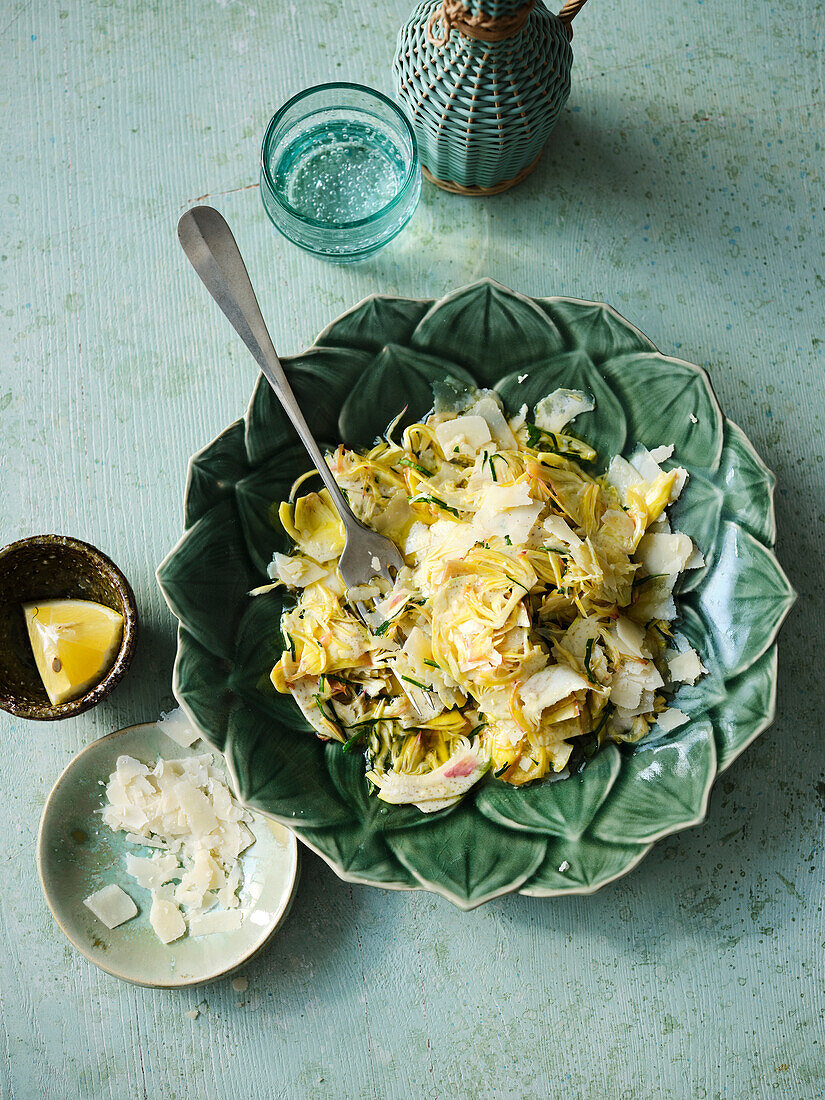 Raw artichoke salad with lemon juice, olive oil and parmesan cheese