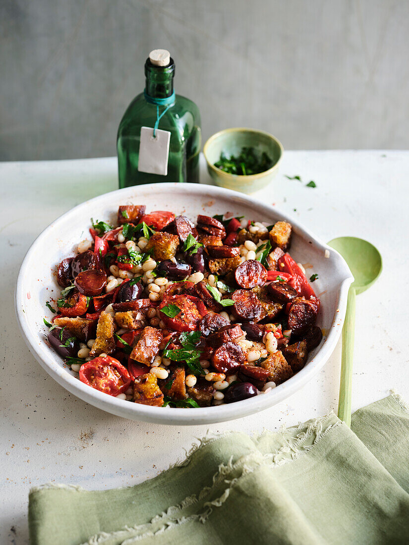 Bread salad with white beans, tomatoes, chorizo and oven peppers