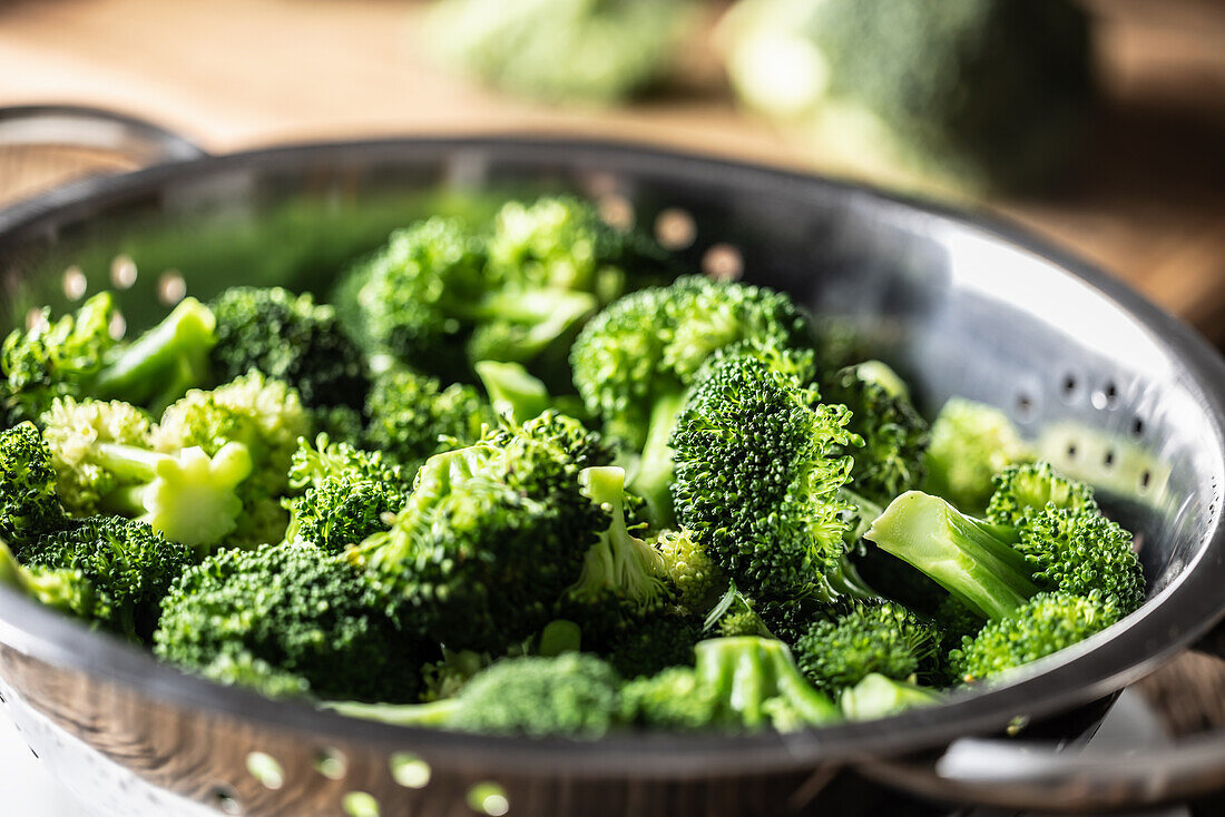 Steamed broccoli in stainless steel steamer