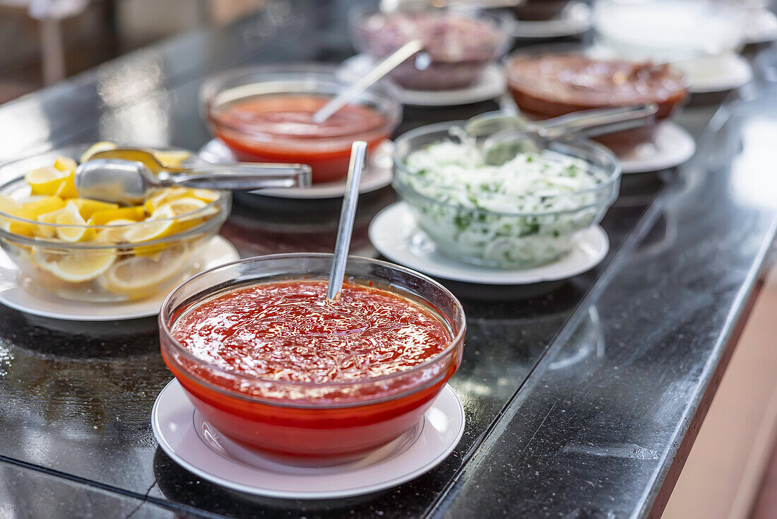 Sweet chilli sauce and various dressings at the buffet in the restaurant