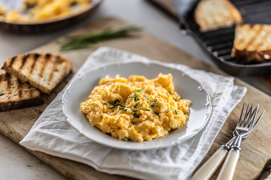 Creamy scrambled eggs and toasted bread