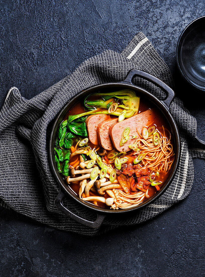 Korean noodle stew with breakfast meat and shimeji