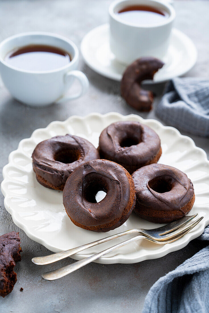 Baked chocolate donuts with glaze