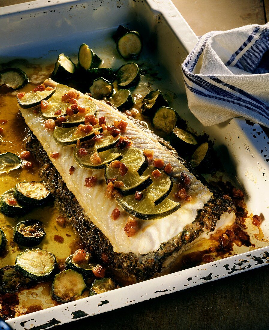 Oven-baked cod fillet with limes, bacon & courgettes