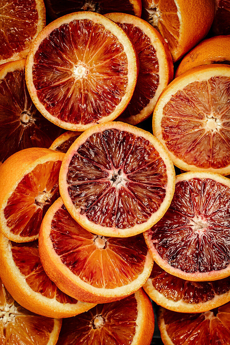 Halved blood oranges (close-up, full frame)