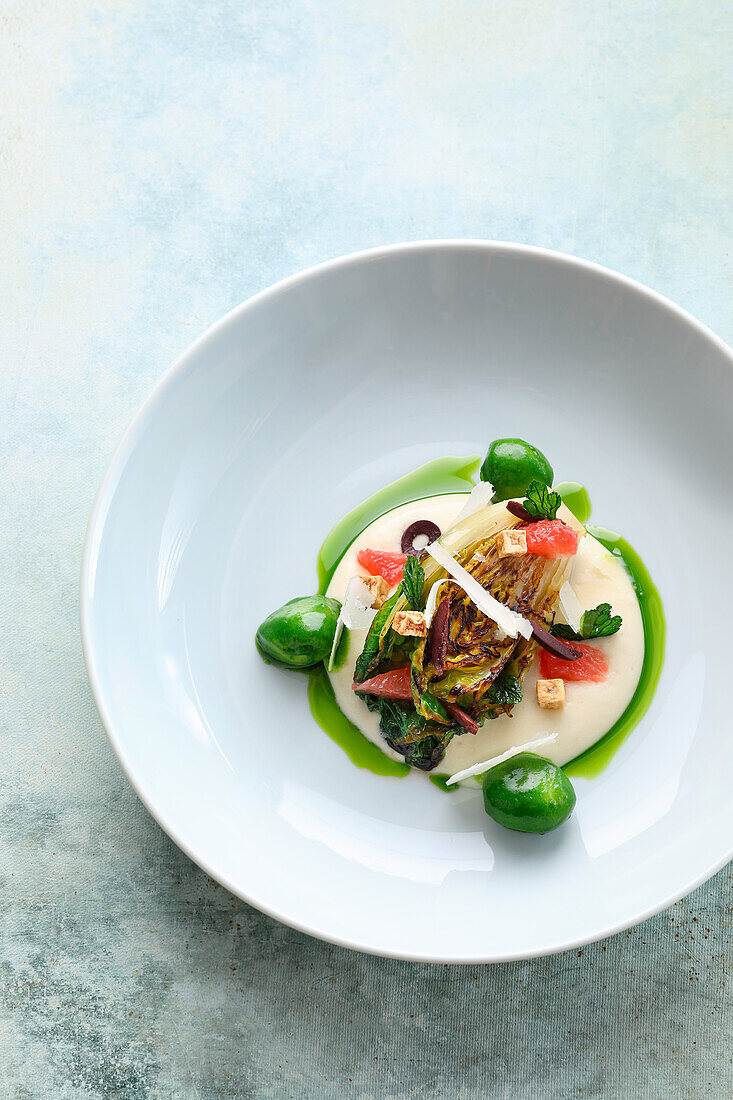 Romaine lettuce with parmesan cream, grapefruit and parsley potatoes