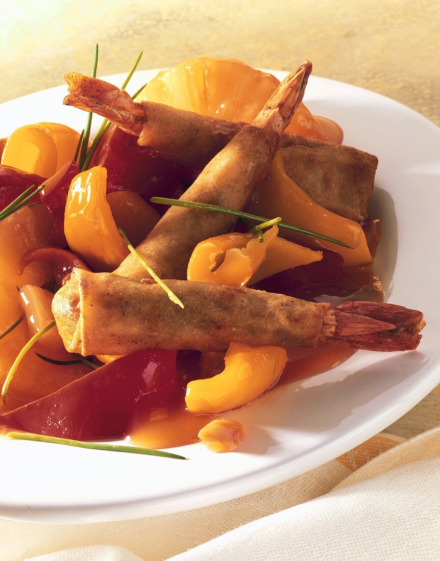 Shrimps in batter with peppers and sweet and sour sauce