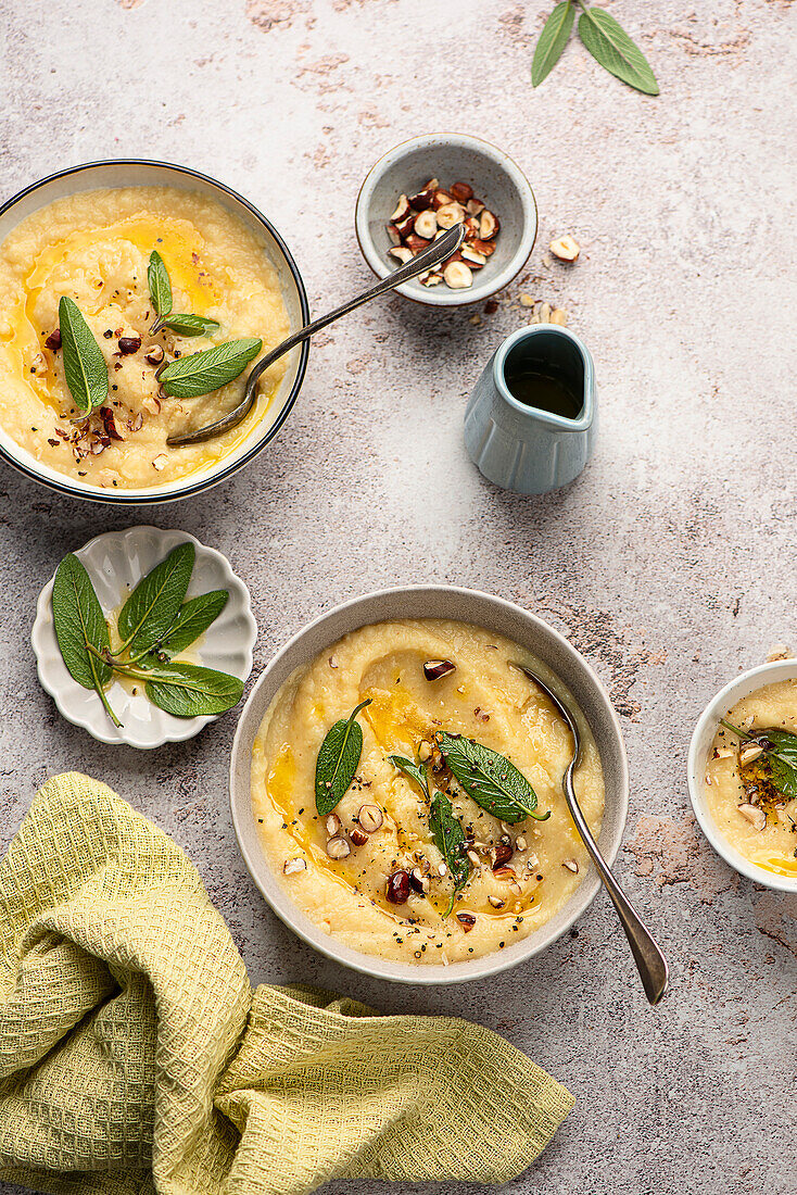 Celery and apple soup with nuts and sage