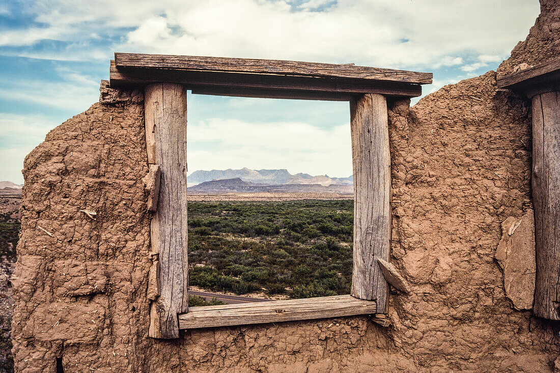 The window of an old ruin at Hot Springs frames the desert landscape in Big Bend National Park in Texas.