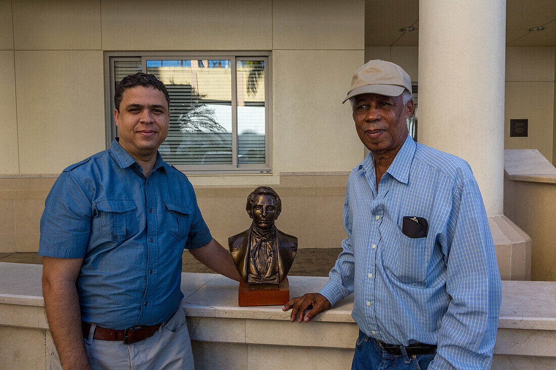 Father & son sculptors, both named Jose Ramon Rotelini, by one of their sculptures in Santo Domingo, Dominican Republic.