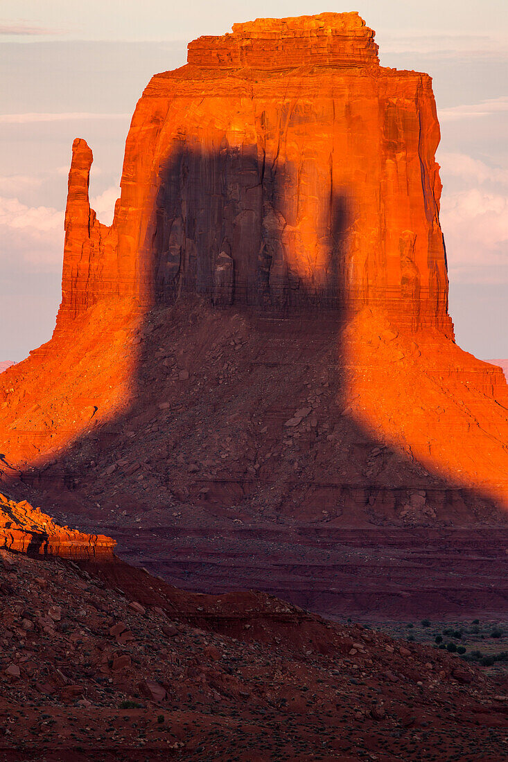 Shadow of the West Mitten projected onto the East Mitten at sunset in the Monument Valley Navajo Tribal Park in Arizona. This phenomenon occurs twice per year.