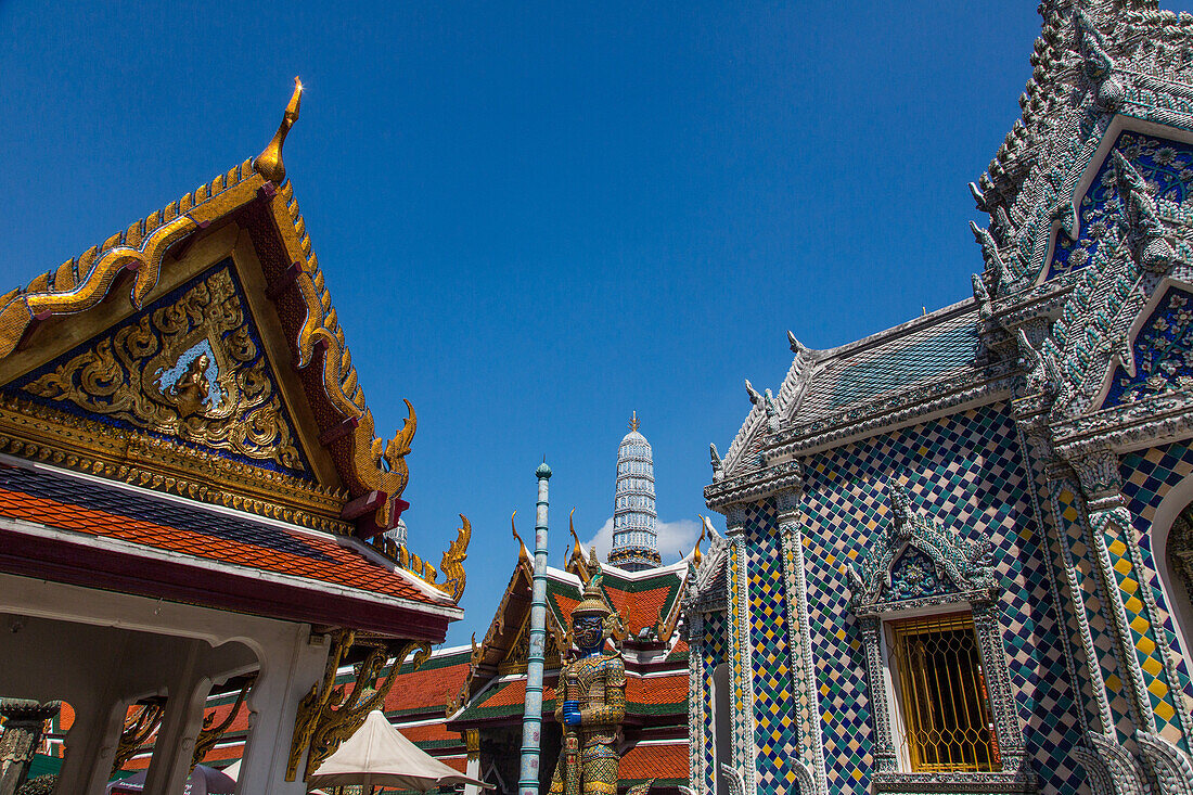 Ornately-decorated buildings by the Temple of the Emerald Buddha at the Grand Palace complex in Bangkok, Thailand.