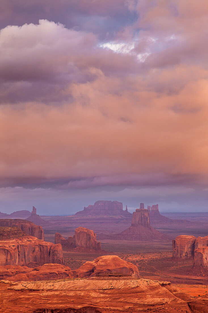 Colorful stormy clouds at sunrise in Monument Valley Navajo Tribal Park in Arizona. View from Hunt's Mesa.