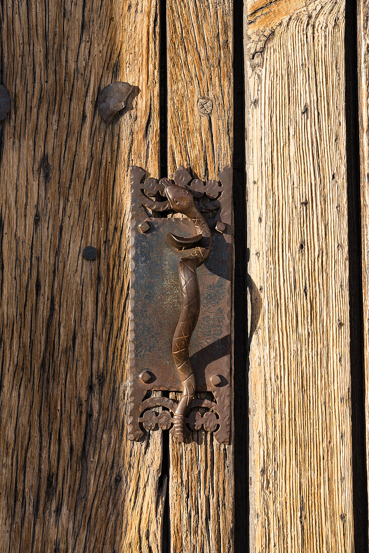 Detail of the cast iron serpent on the door handle of the entry door in the Mission San Xavier del Bac, Tucson Arizona.