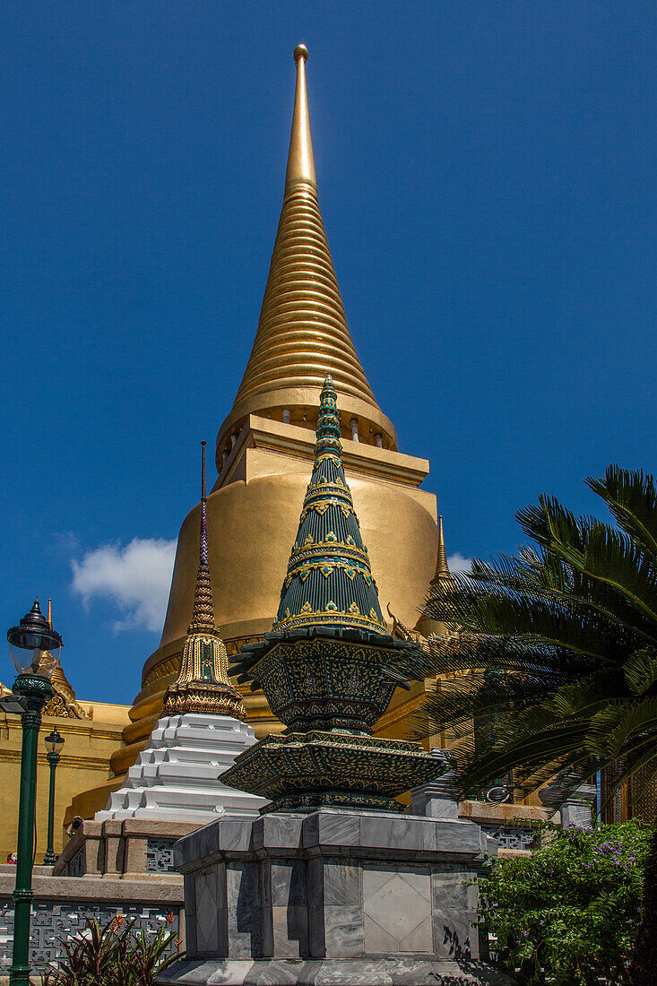 The golden Phra Sri Ratana Chedi by the Temple of the Emerald Buddha at the Grand Palace complex in Bangkok, Thailand.
